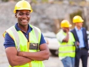 20022641 - happy african industrial worker with arms folded