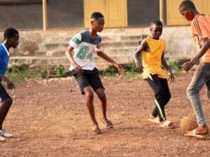 full-shot-kids-playing-with-ball-outside (1)